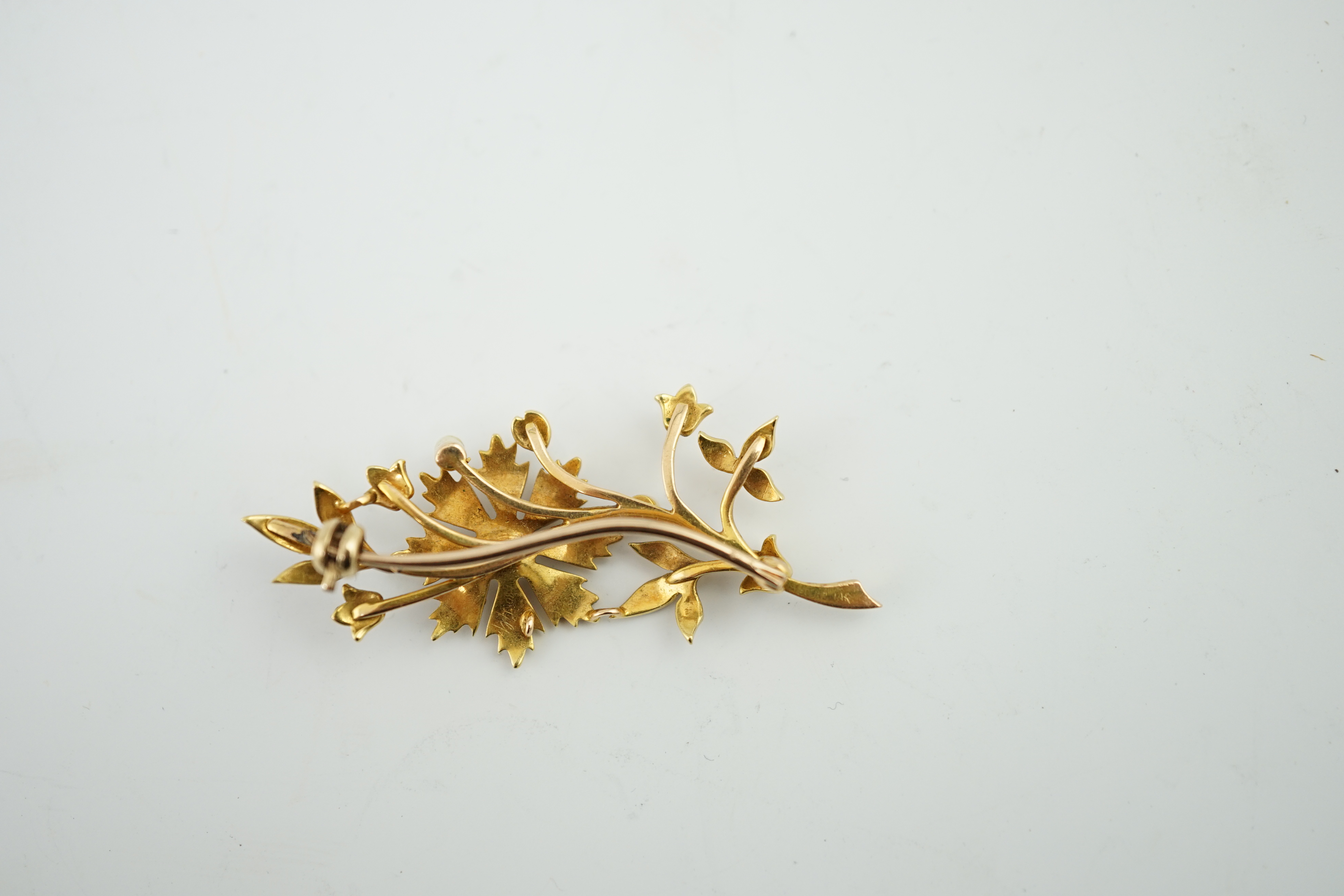 An Edwardian gold and graduated seed pearl set foliate brooch